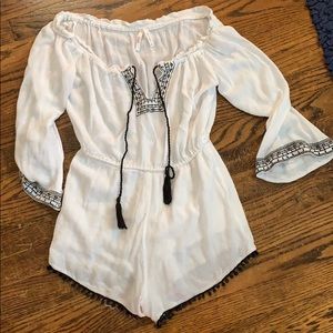 White flowy black embroidered romper
